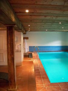 a large swimming pool in a bathroom with at Gästehaus Bichl in Umhausen