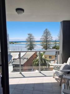 a view of a balcony with a view of the ocean at Apartment at The Entrance in The Entrance