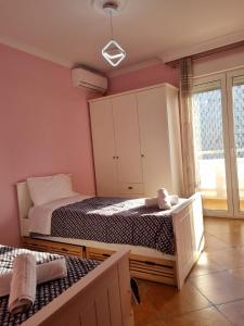 Кровать или кровати в номере Top View Apartment in Tirana City Center