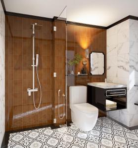 a bathroom with a shower and a toilet and a sink at Baglioni Signature in Ho Chi Minh City