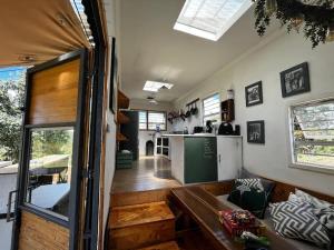 a living room and kitchen of a tiny house at Self Sustainable,Tiny Home On 5 Acres in Lusaka