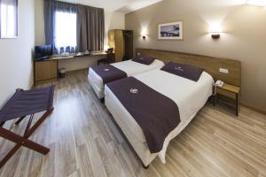 Postel nebo postele na pokoji v ubytování Tulip Inn Padova