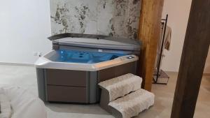 a blue tub in a room with a sink at Appartement d'une chambre avec jacuzzi terrasse et wifi a Duppigheim in Duppigheim
