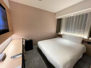 Uma TV ou centro de entretenimento em Henn na Hotel Premier Nara