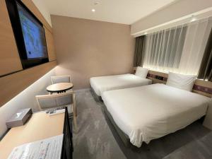 Cama ou camas em um quarto em Henn na Hotel Premier Nara