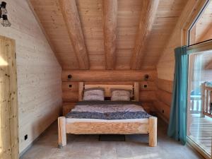 Postel nebo postele na pokoji v ubytování Böhmerwald Lodges