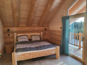 Postel nebo postele na pokoji v ubytování Böhmerwald Lodges