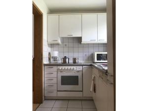 Η κουζίνα ή μικρή κουζίνα στο Holiday apartment Peacock