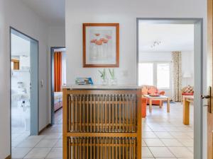 a living room with a kitchen and a living room with a couch at House on the sunny slope type B in Eslohe