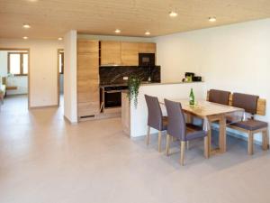 a kitchen and dining room with a table and chairs at Apartment Tenne in Königheim