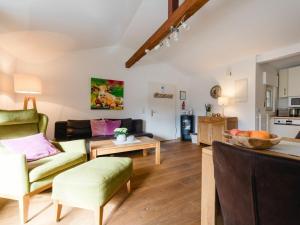 a living room with a couch and a table at Krähenberg Country House in Eslohe