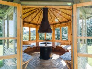 a wooden cabin with a round table in the middle at Country House Mettenberg in Eslohe