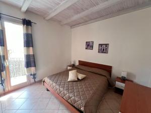 Letto o letti in una camera di Casa Vacanze A' Lanterna