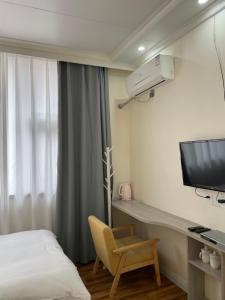 TV a/nebo společenská místnost v ubytování Youranju Guesthouse