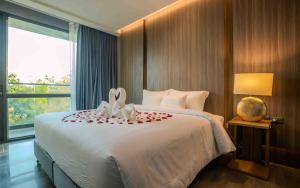 Кровать или кровати в номере Mountain View@nimman12 Hotel & Resort