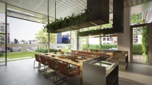 een grote keuken met een lange tafel en stoelen bij Skyline Treat Apt in Middle of Shopping Haven in Melbourne