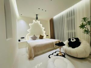 Una cama o camas en una habitación de Pingtan Tannanwan Hailanju Guesthouse
