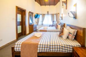 מיטה או מיטות בחדר ב-Grand Argyle Resort