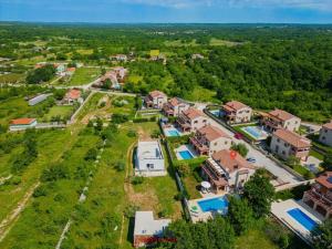 an aerial view of a house with a yard at Villa Wish Comfortable holiday residence in Čabrunići