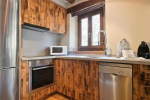 Kuchyňa alebo kuchynka v ubytovaní LUDERNA - Apartamento Pin Roi + 5 fotografií