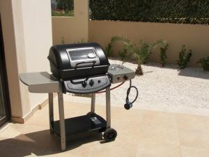 a toaster sitting on a table with a grill at Modern 3 bedroom villa, pool and close to golf course in Paphos