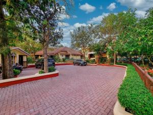 a driveway of a house with cars parked in the driveway at Zaras Resort Khandala in Lonavala