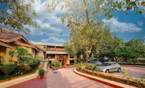 a car parked in front of a building at Zaras Resort Khandala in Lonavala