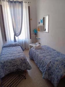 Postel nebo postele na pokoji v ubytování locazione Lety