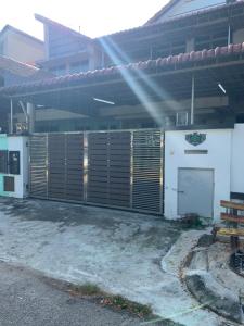 a building with a gate in front of it at Johor home in Johor Bahru