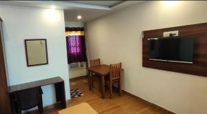 TV a/nebo společenská místnost v ubytování Hotel New Cresent park + 20 fotografií