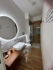 a bathroom with a sink and a mirror at La dimora degli scrittori in Porto Empedocle