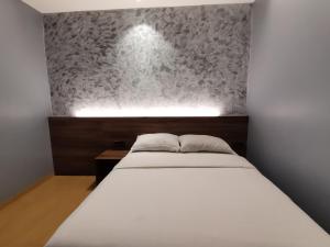 Voodi või voodid majutusasutuse Lumut Hotel toas