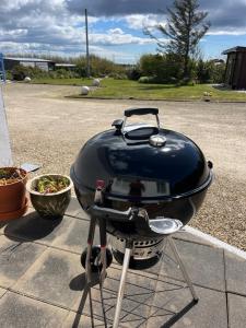 a grill with a pot sitting on top of it at Beachcomber Cottages in Ballyconneely