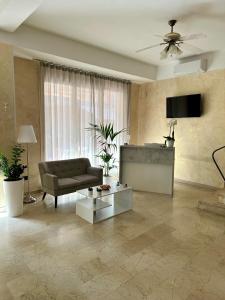 TV a/nebo společenská místnost v ubytování Hotel Enna Rimini