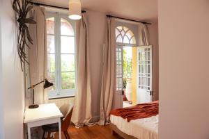 Postel nebo postele na pokoji v ubytování Maison Arcades chambre 2 + 4 fotografie