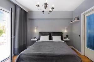Ένα ή περισσότερα κρεβάτια σε δωμάτιο στο Five Seasons Alimos