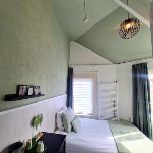 Voodi või voodid majutusasutuse Hotel 't Witte Huys Scheveningen toas