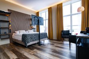 Postel nebo postele na pokoji v ubytování Hotel Zeezicht