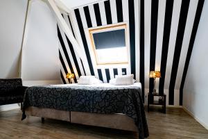 Postel nebo postele na pokoji v ubytování Hotel Zeezicht