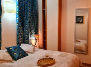 a bedroom with a bed with a tray on it at Il Nido di legno in Udine