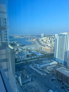 a view of a city from a building at fantastic city & Seaview Master bedroom in 3bedroom apartment in Ajman 