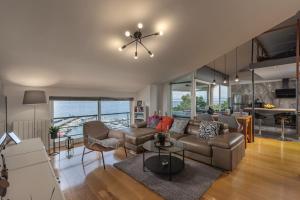 a living room with a couch and a table at Apartments Sax in Crikvenica
