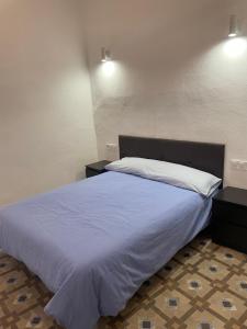 Кровать или кровати в номере Ricar Rooms