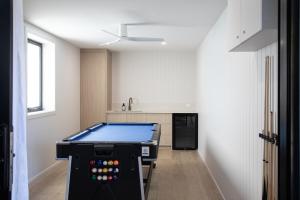 a kitchen with a pool table in a room at The Lodge - 4 Luxury Central Private Studio Rooms - Free wifi in Mount Gambier