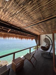 a living room with a view of the ocean at Rock'n Reef in Uluwatu