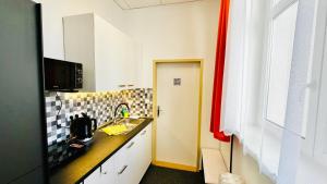 Kuchyňa alebo kuchynka v ubytovaní Apartments Radka