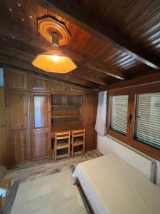 a bedroom with a bed and a table in it at Villa Ocean in Paralia Dionysiou