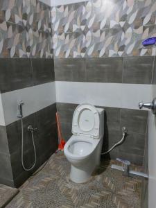 Um banheiro em Kausthubham