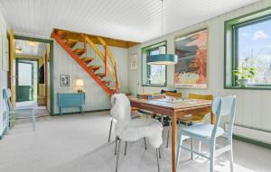 a dining room with a table and chairs at 3 Bedroom Beautiful Home In Ørsted in Ørsted