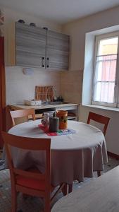 a kitchen with a table with a table cloth on it at Le Balcon in Sélestat